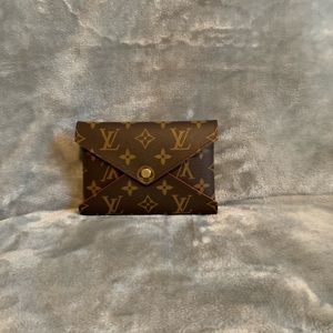 Authentic Louis Vuitton med/Sm Kirigami Pochette
